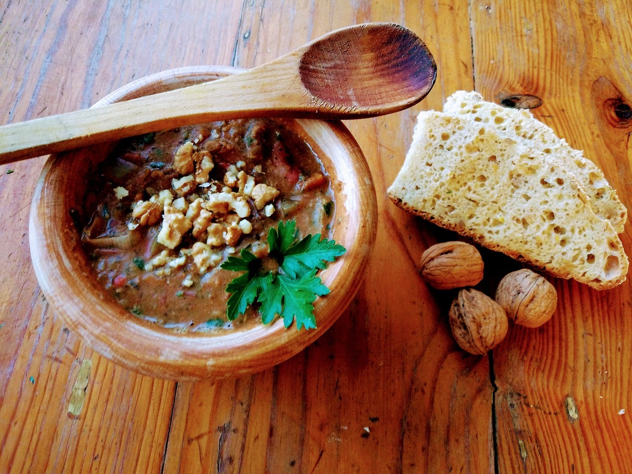 Amoelsili Lobio served in a wooden bowl with home made bread.