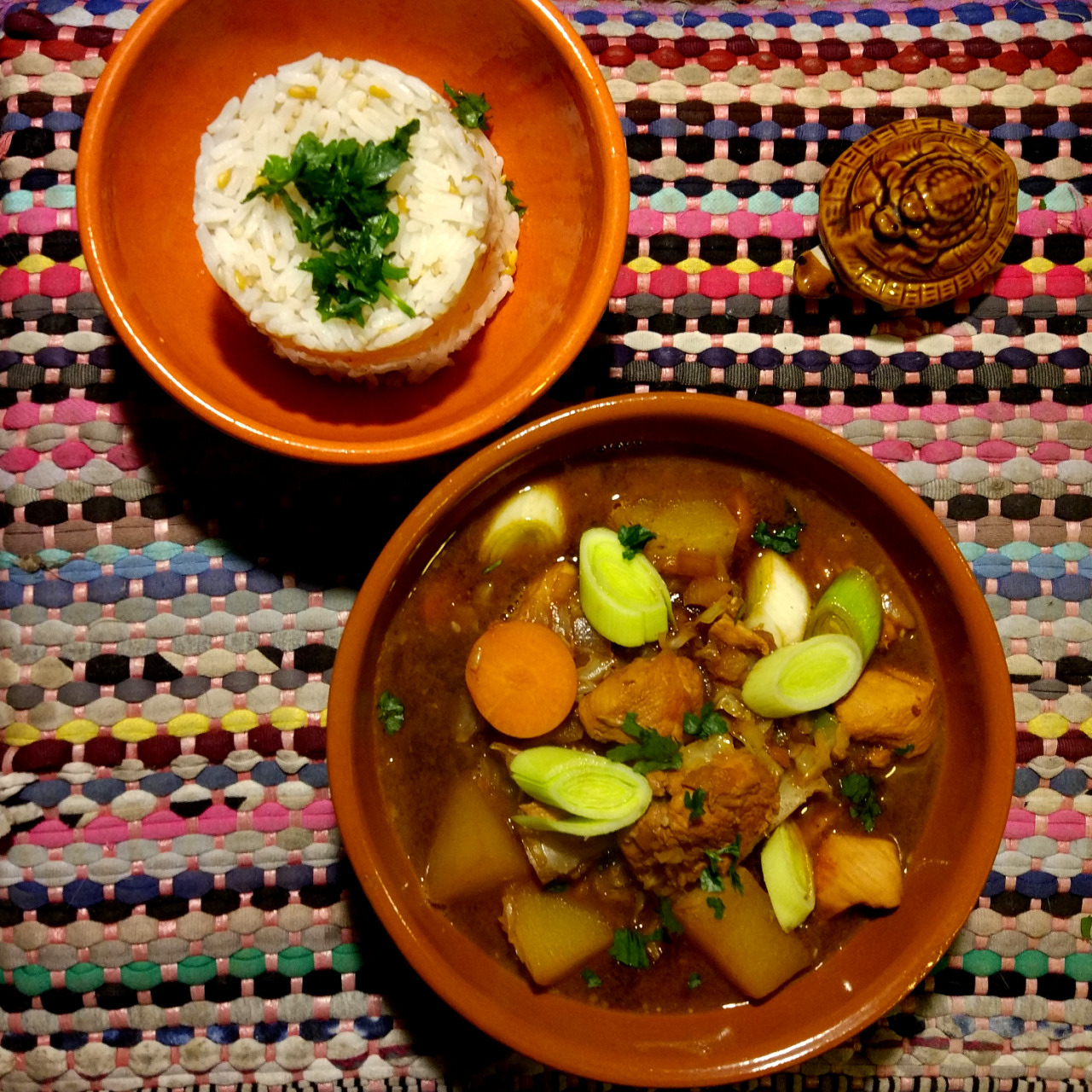 Dakdoritang served in a bowl next to a ration of white rice.