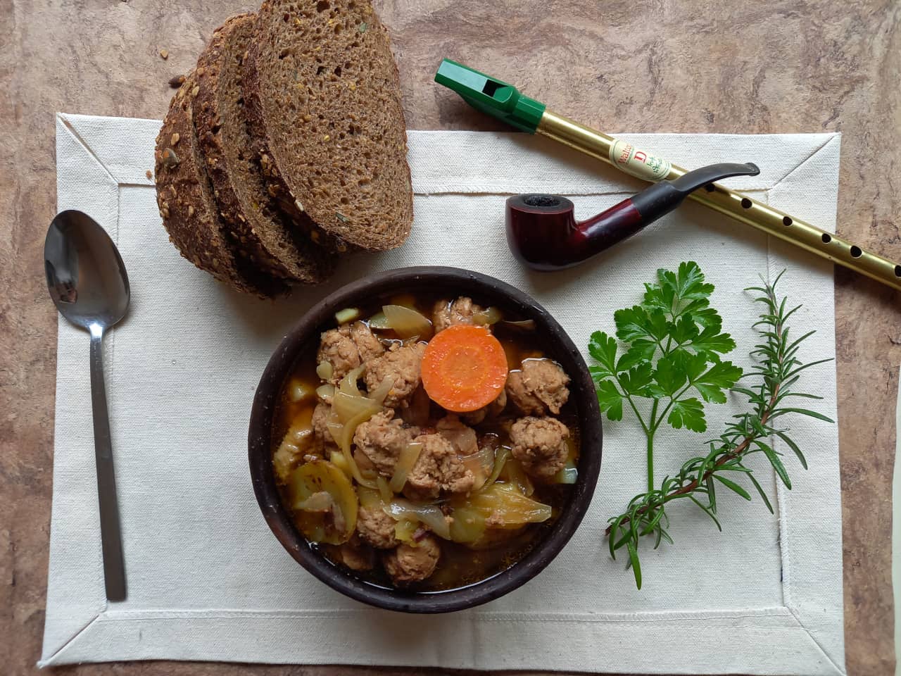 A bowl of Coddle. The pork sausage here was cut to short, resulting in a blooming sausage effect.