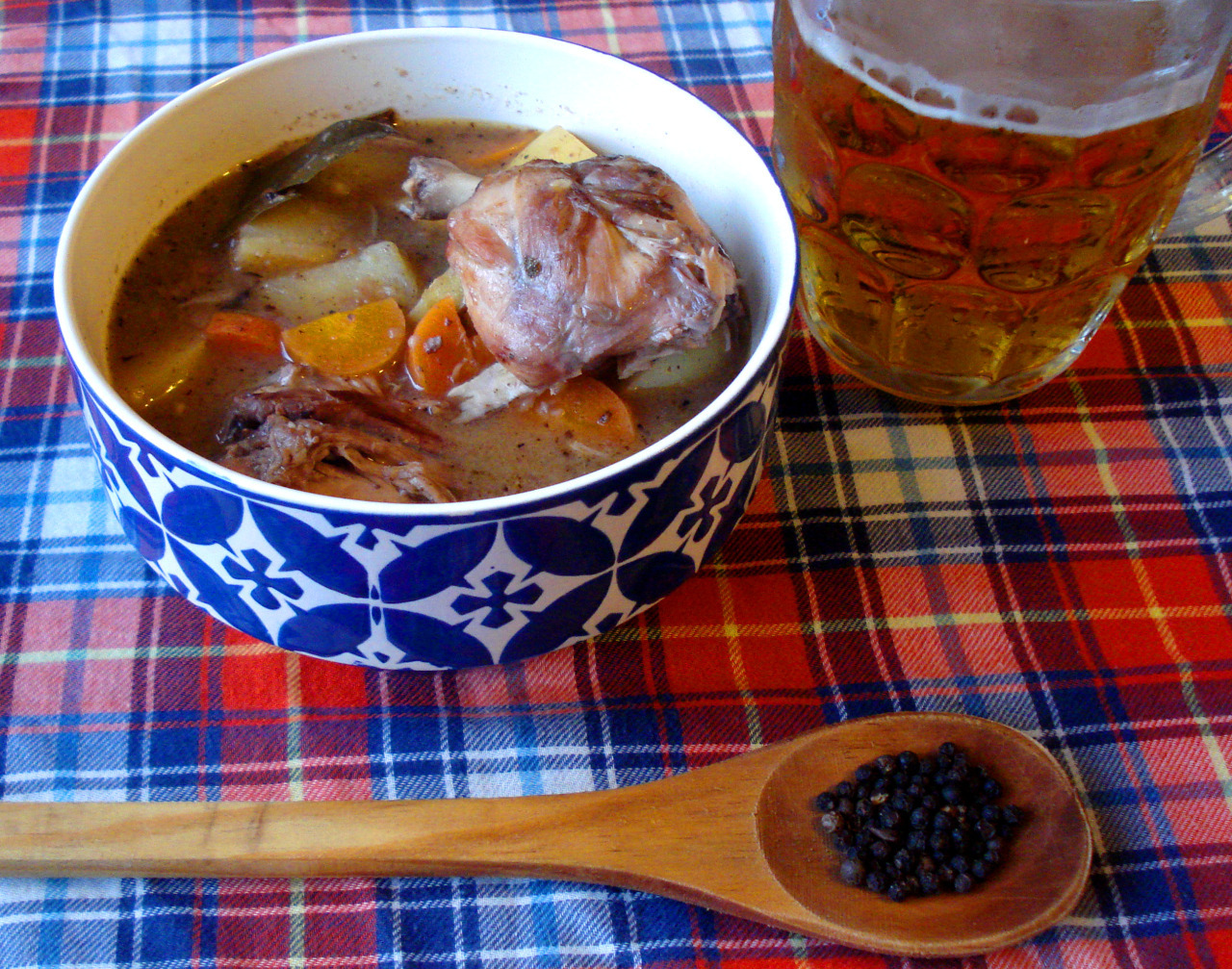 A bowl of german Hasenpfeffer served with laguer beer.