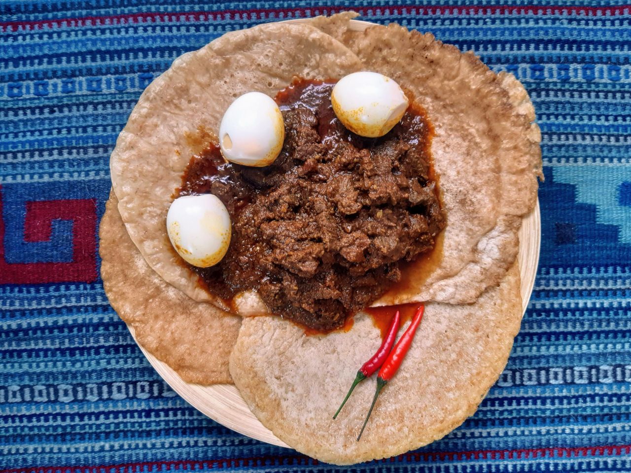 Sega Wat served on top of injera bread.